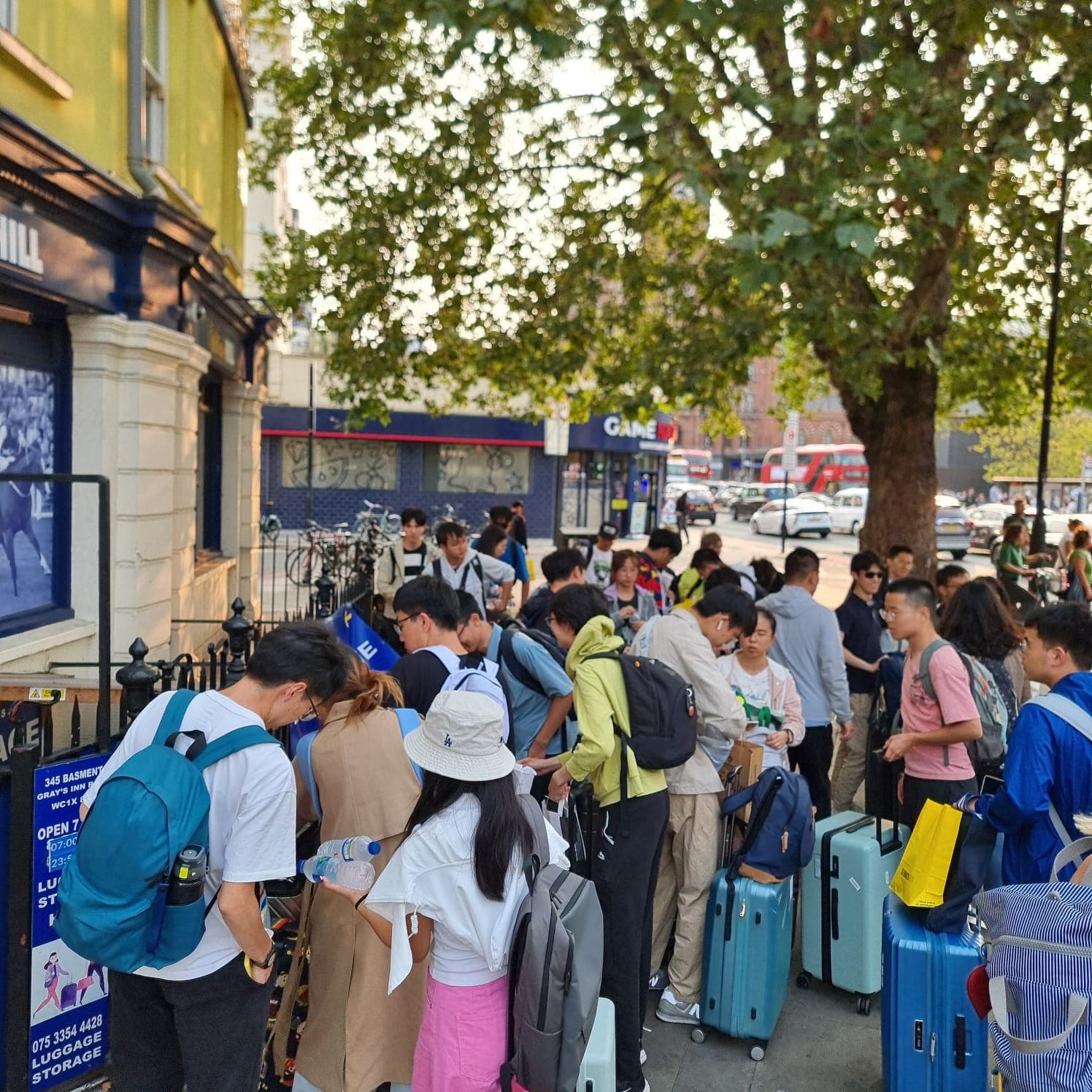 Travellers using staffed luggage storage near Paddington